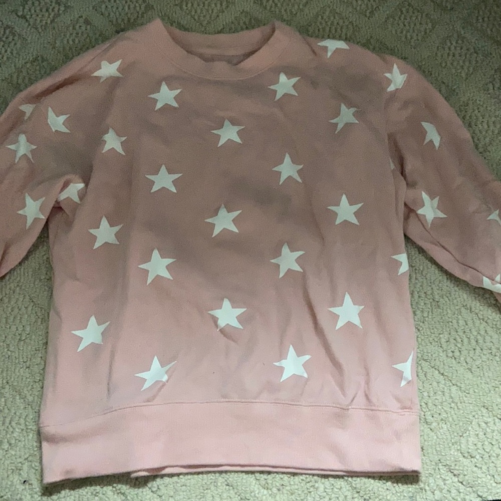 Pink crew neck sweatshirt with white star details